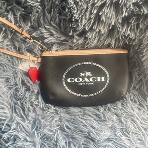 Coach clutch wristlet black with tan strap new with tags Originally $98